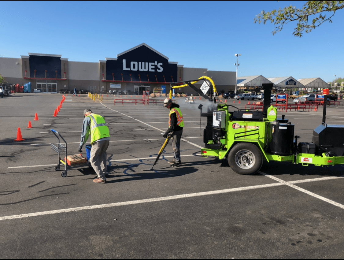 U-SEAL USA crew performing commercial crack sealing at a Connecticut Lowe’s parking lot